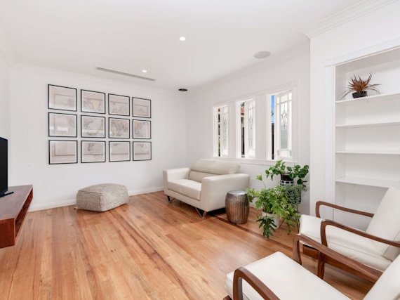 Stylish living room with open concept design and hardwood flooring