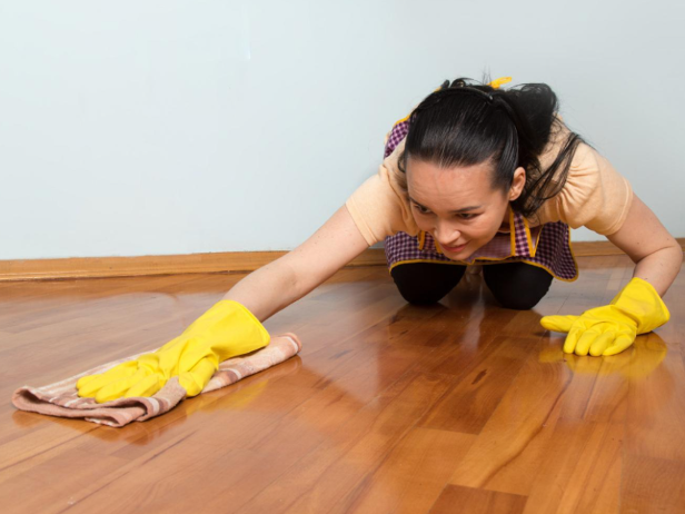 Woman washing a hardwood floor