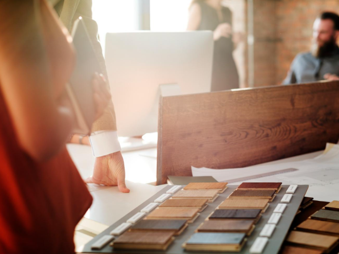 Choosing Flooring Samples in a Flooring Showroom