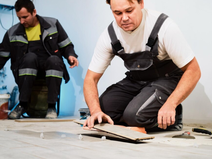 Professional flooring contractors installing floors