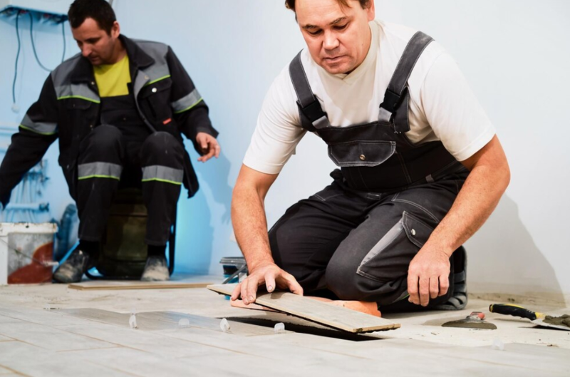 Professional Flooring Contractors installing wood plank floors