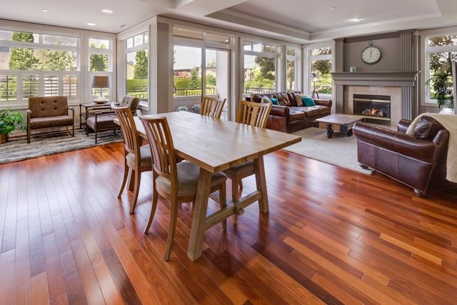 Dining room with warm hardwood flooring